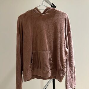 A velvet hoodie. Pink and with pockets